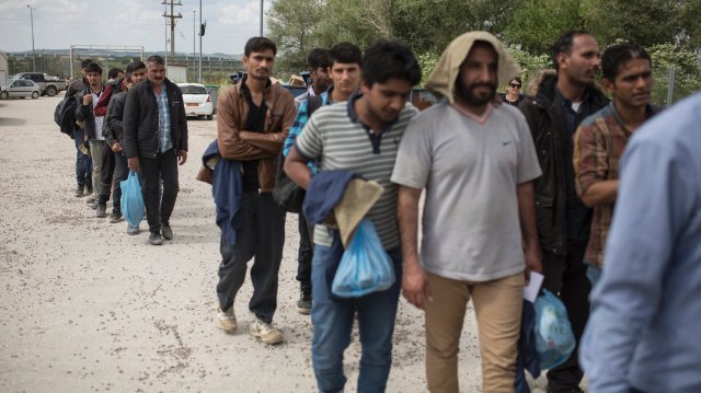 Refugees near the Evros arriving at a camp for migrants who have just entered the country